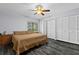 Comfortable bedroom featuring a ceiling fan, spacious closet, and modern flooring at 3709 Greenery Ct # 209, Tampa, FL 33618