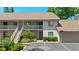 Inviting two-story condo with charming stairs, balcony, and lovely landscaping at 3709 Greenery Ct # 209, Tampa, FL 33618