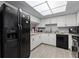 Bright kitchen features a full suite of appliances and tile flooring at 3709 Greenery Ct # 209, Tampa, FL 33618