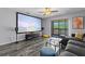 Living room with projector screen and a sliding glass door to a balcony at 3709 Greenery Ct # 209, Tampa, FL 33618