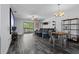 Open living space with dark wood floors, slider doors, and comfortable furnishings at 3709 Greenery Ct # 209, Tampa, FL 33618
