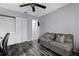 Office featuring a comfortable couch, ceiling fan and closet storage at 3709 Greenery Ct # 209, Tampa, FL 33618