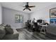 Bedroom converted into a home office space with a ceiling fan and natural light at 3709 Greenery Ct # 209, Tampa, FL 33618