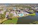 An aerial view of lakeside community with pool and recreational area, highlighting its prime waterfront location at 3824 Cortez Dr # B, Tampa, FL 33614