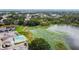 Aerial view showcasing the lakeside property and the abundance of green scenery around the community at 3824 Cortez Dr # B, Tampa, FL 33614