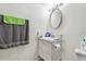 Bathroom vanity with modern fixtures, decorative mirror, and soft lighting at 3824 Cortez Dr # B, Tampa, FL 33614