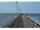 Scenic view of a fishing pier extending into the ocean, offering a great fishing and walking experience at 3850 Sablewood Dr, Holiday, FL 34691