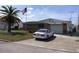 Charming single story home featuring a driveway and well-manicured lawn at 3850 Sablewood Dr, Holiday, FL 34691