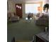 Living room features a large window, comfortable seating, and a glass coffee table at 3850 Sablewood Dr, Holiday, FL 34691