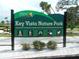 Key Vista Nature Park sign showcasing park amenities with greenery and a clear blue sky backdrop at 3850 Sablewood Dr, Holiday, FL 34691