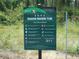 Coastal Anclote Trail sign displaying trail rules and etiquette, promoting a safe outdoor experience at 3850 Sablewood Dr, Holiday, FL 34691