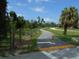Anclote Trail: Paved path winding through lush greenery, perfect for walking and biking amidst nature at 3850 Sablewood Dr, Holiday, FL 34691
