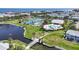 Beautiful aerial view of community amenities including tennis courts and a pool and clubhouse overlooking the ocean at 5003 Starfish Dr Se # B, St Petersburg, FL 33705