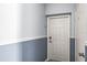 Condo entryway featuring neutral paint scheme with white trim and classic six-panel door at 5003 Starfish Dr Se # B, St Petersburg, FL 33705