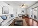 Open-concept living room with contemporary decor, wood floors, and inviting furniture arrangement at 5003 Starfish Dr Se # B, St Petersburg, FL 33705