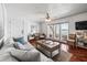 Bright living room featuring a comfortable seating arrangement, with doors to the outside at 5003 Starfish Dr Se # B, St Petersburg, FL 33705