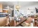 Open-concept living space with wood floors, stainless steel appliances, and view to living room at 5003 Starfish Dr Se # B, St Petersburg, FL 33705