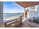 Charming patio features brick pavers, outdoor seating, and waterfront views at 5003 Starfish Dr Se # B, St Petersburg, FL 33705