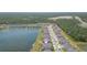 Aerial view of the property and the surrounding community with lush green spaces and ponds at 5059 Bromeliad Ave, Wimauma, FL 33598