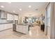 Open kitchen featuring stainless appliances, granite countertops, and ample cabinet space at 5059 Bromeliad Ave, Wimauma, FL 33598