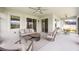 Spacious screened lanai with outdoor seating and dining areas, ideal for enjoying the outdoors at 5059 Bromeliad Ave, Wimauma, FL 33598