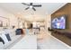 Open living area featuring tile floors, modern furniture, and a view to the kitchen at 5059 Bromeliad Ave, Wimauma, FL 33598