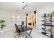 Contemporary office featuring modern desk and shelving, comfortable seating, and stylish decor and lighting at 5059 Bromeliad Ave, Wimauma, FL 33598