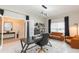 Bright office features modern lighting, neutral walls, and sleek furniture at 5059 Bromeliad Ave, Wimauma, FL 33598