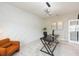Bright office with geometric wall accents, modern desk, comfortable seating, and contemporary lighting at 5059 Bromeliad Ave, Wimauma, FL 33598