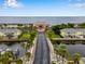 Stunning aerial of property with picturesque landscaping leading to the waterfront at 5102 Coquina Key Se Dr # D, St Petersburg, FL 33705