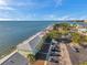Aerial view of waterfront condos with a parking lot and water views at 5102 Coquina Key Se Dr # D, St Petersburg, FL 33705