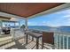 Balcony with table and chairs overlooking a picturesque ocean view at 5102 Coquina Key Se Dr # D, St Petersburg, FL 33705