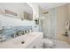 Updated bathroom has a tub and shower with a glass enclosure at 5102 Coquina Key Se Dr # D, St Petersburg, FL 33705
