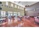Spacious clubhouse featuring high ceilings, wood floors, nautical decor, and ample seating at 5102 Coquina Key Se Dr # D, St Petersburg, FL 33705
