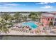 A community pool with lounge chairs and tables with direct water views at 5102 Coquina Key Se Dr # D, St Petersburg, FL 33705