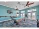 Community game room with pool table, ceiling fans, and ocean view at 5102 Coquina Key Se Dr # D, St Petersburg, FL 33705