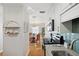 Charming kitchen with white cabinets and stainless appliances, leading to an adjacent dining area at 5102 Coquina Key Se Dr # D, St Petersburg, FL 33705
