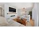 Comfortable living room featuring plush seating, stylish decor, and a sleek fireplace at 5102 Coquina Key Se Dr # D, St Petersburg, FL 33705