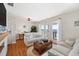 Comfortable living room with water views, plush seating, and a charming office nook at 5102 Coquina Key Se Dr # D, St Petersburg, FL 33705