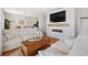 Inviting living room with plush seating, stylish decor, and a modern fireplace feature at 5102 Coquina Key Se Dr # D, St Petersburg, FL 33705
