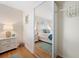 Mirrored closet reveals a bright main bedroom with hardwood floors at 5102 Coquina Key Se Dr # D, St Petersburg, FL 33705