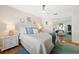 Bright bedroom has decor, ceiling fan, night stands, and a mirrored closet at 5102 Coquina Key Se Dr # D, St Petersburg, FL 33705
