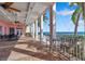 Beautiful waterfront patio with cozy seating, ceiling fans and picturesque coastal views at 5102 Coquina Key Se Dr # D, St Petersburg, FL 33705