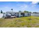 Beautiful backyard with deck featuring lounge furniture, perfect for relaxing outdoors at 5117 Fitchburg Dr, Holiday, FL 34690