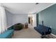 Bright bedroom with carpet, beanbag chair, futon, and a view to another room at 5117 Fitchburg Dr, Holiday, FL 34690