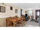Cozy dining room with a wooden table and chairs, seamlessly connected to the living room at 5117 Fitchburg Dr, Holiday, FL 34690