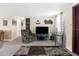 Comfortable living room featuring carpet flooring, a large TV, and natural light at 5117 Fitchburg Dr, Holiday, FL 34690