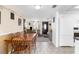 Inviting living space with a wooden dining table and seamless flow to the living room at 5117 Fitchburg Dr, Holiday, FL 34690