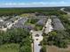 Aerial view of the townhome community entrance featuring a well-maintained streetscape at 6225 Scarlet Darter Way, Tampa, FL 33625
