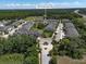 Community aerial view showing well-maintained townhomes, lush landscaping, and nearby amenities at 6225 Scarlet Darter Way, Tampa, FL 33625